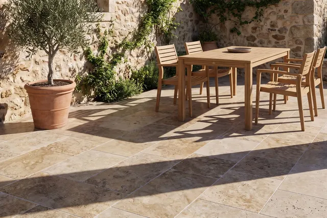 Country Classic Standard travertine pavers on a walled terrace — ambient scene.